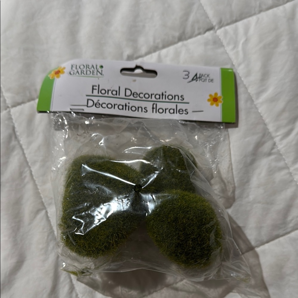 Floral Decorations. Moss covered stones .